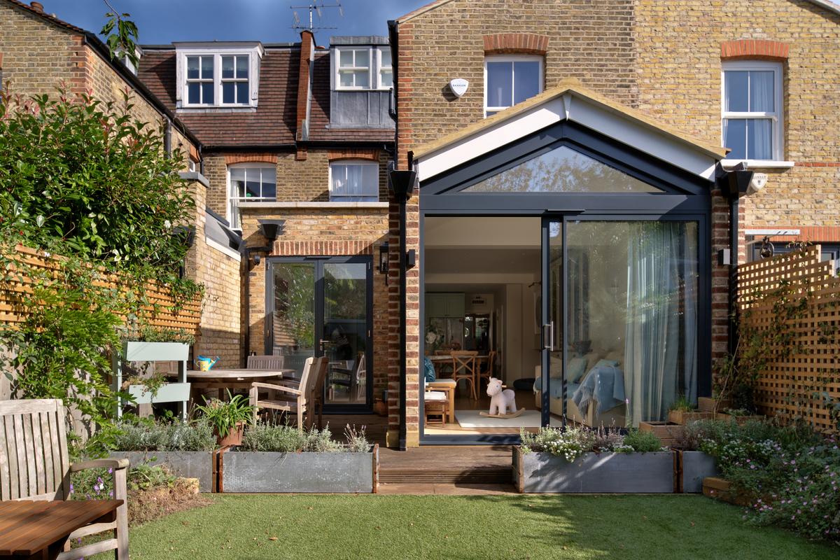 From the lawn, with the deck running the full width.
