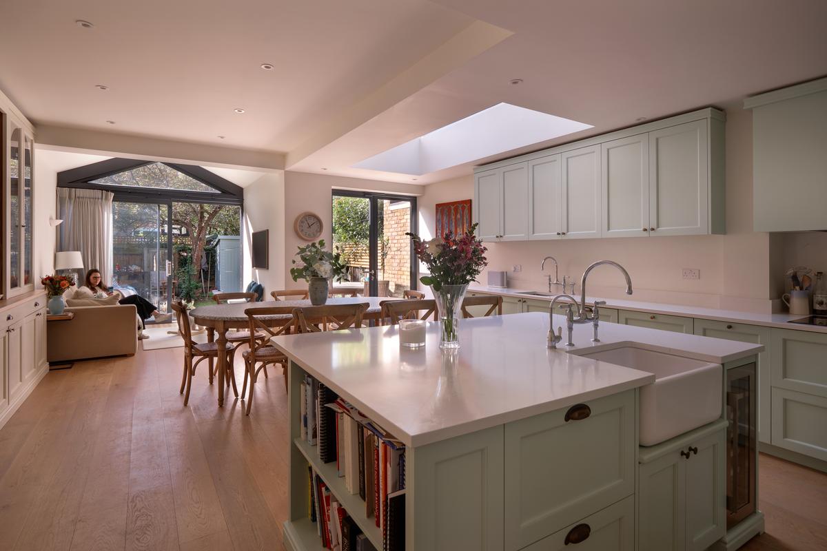 The kitchen, looking back through to the living end.