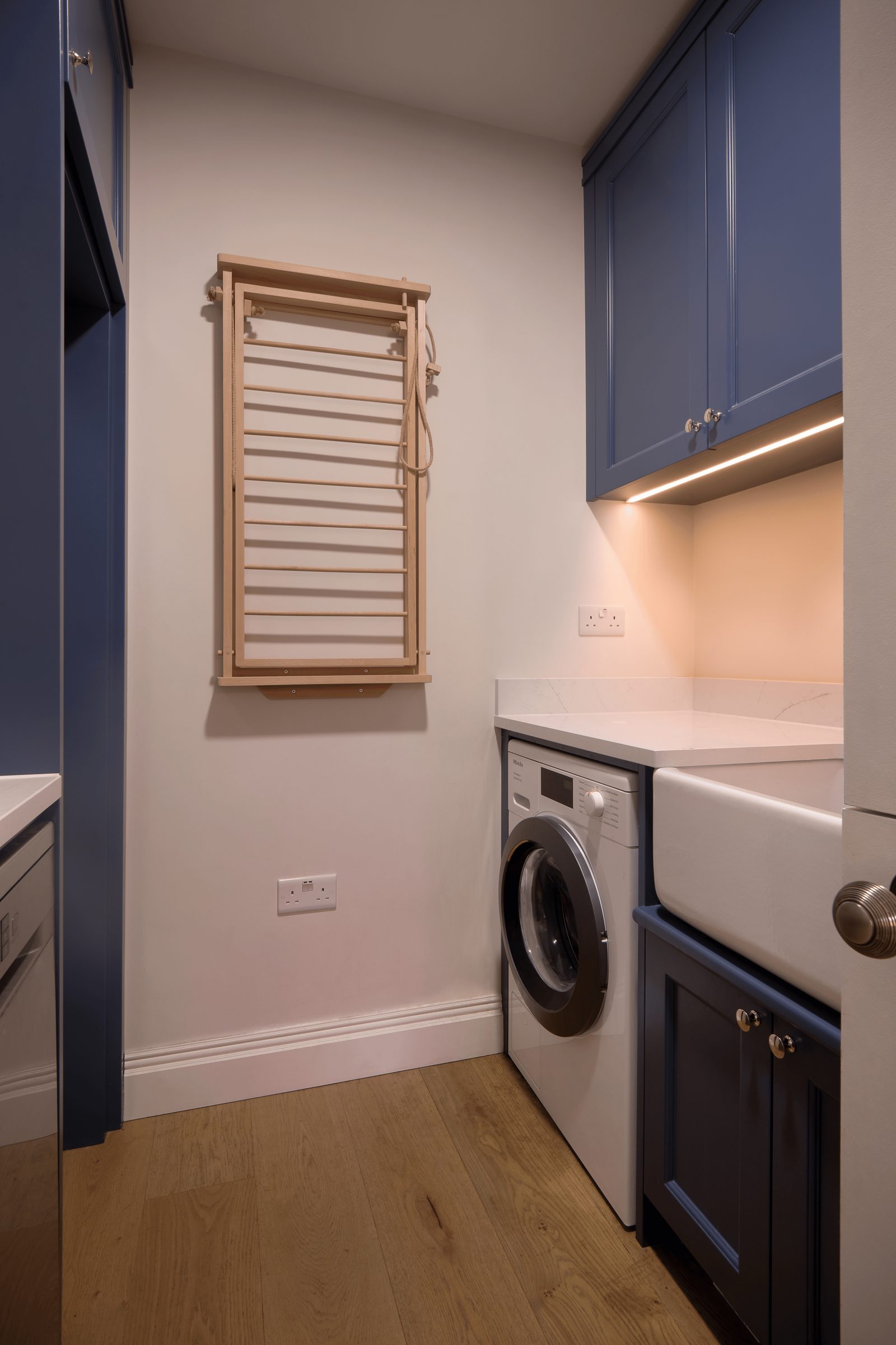The utility, with the laundry behind a blue door.
