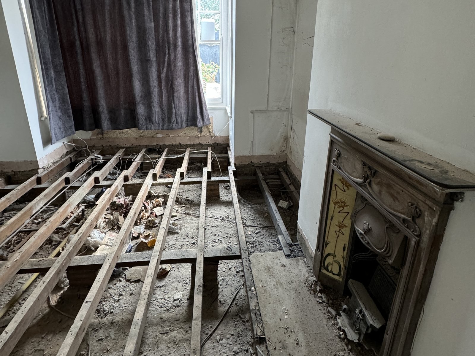 The floor stripped back to its joists.