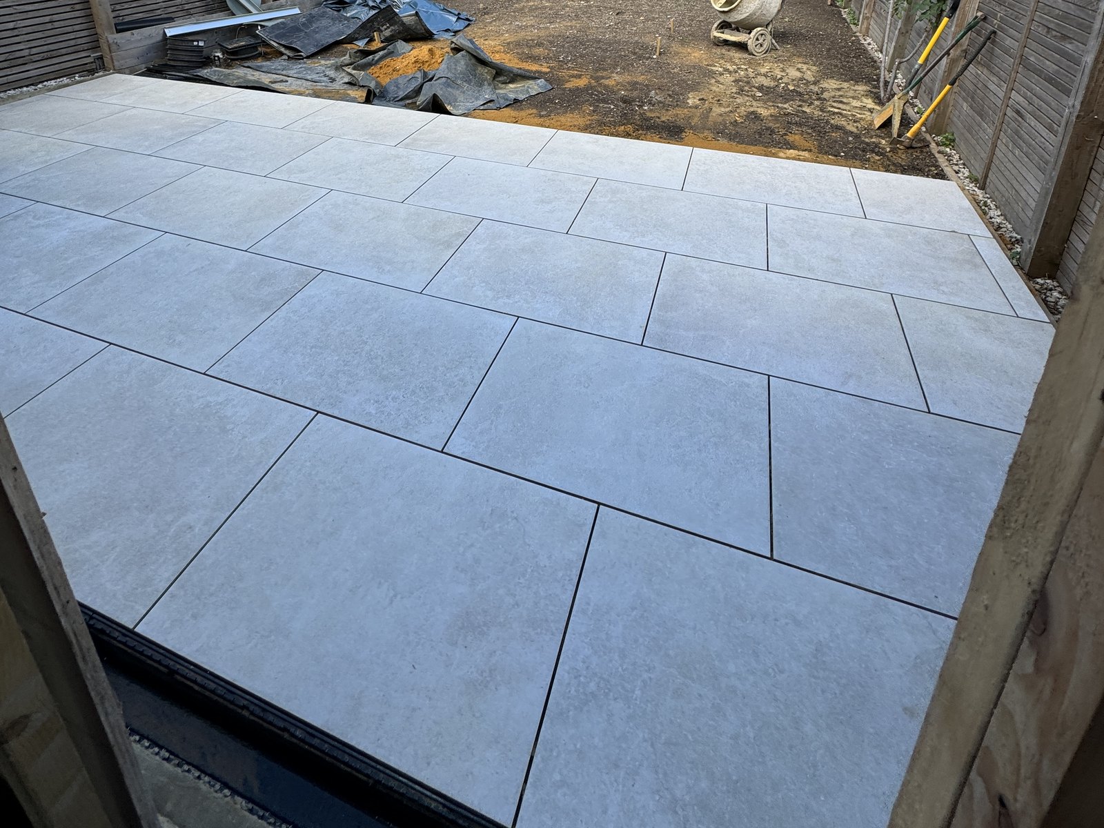 The new paving laid outside the folding doors, before the garden was levelled and turfed.