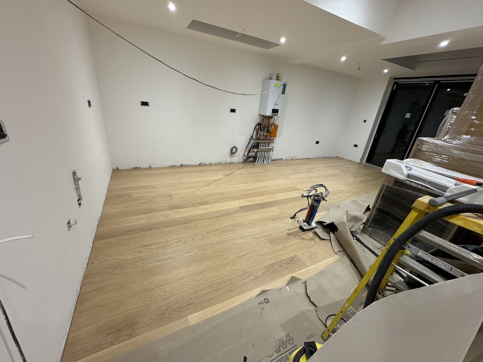 The timber floor going down over the heated screed.