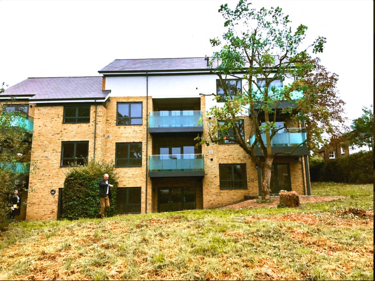 The finished building. The top floor is the new one