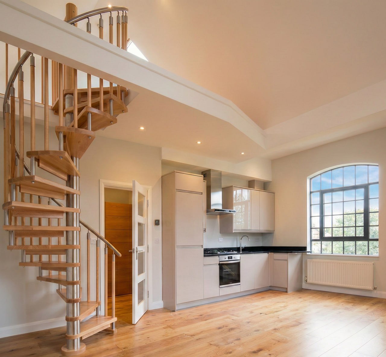 A spiral stair up to the second apartment.